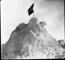 Image of Josephine's flag on snow/ice peak